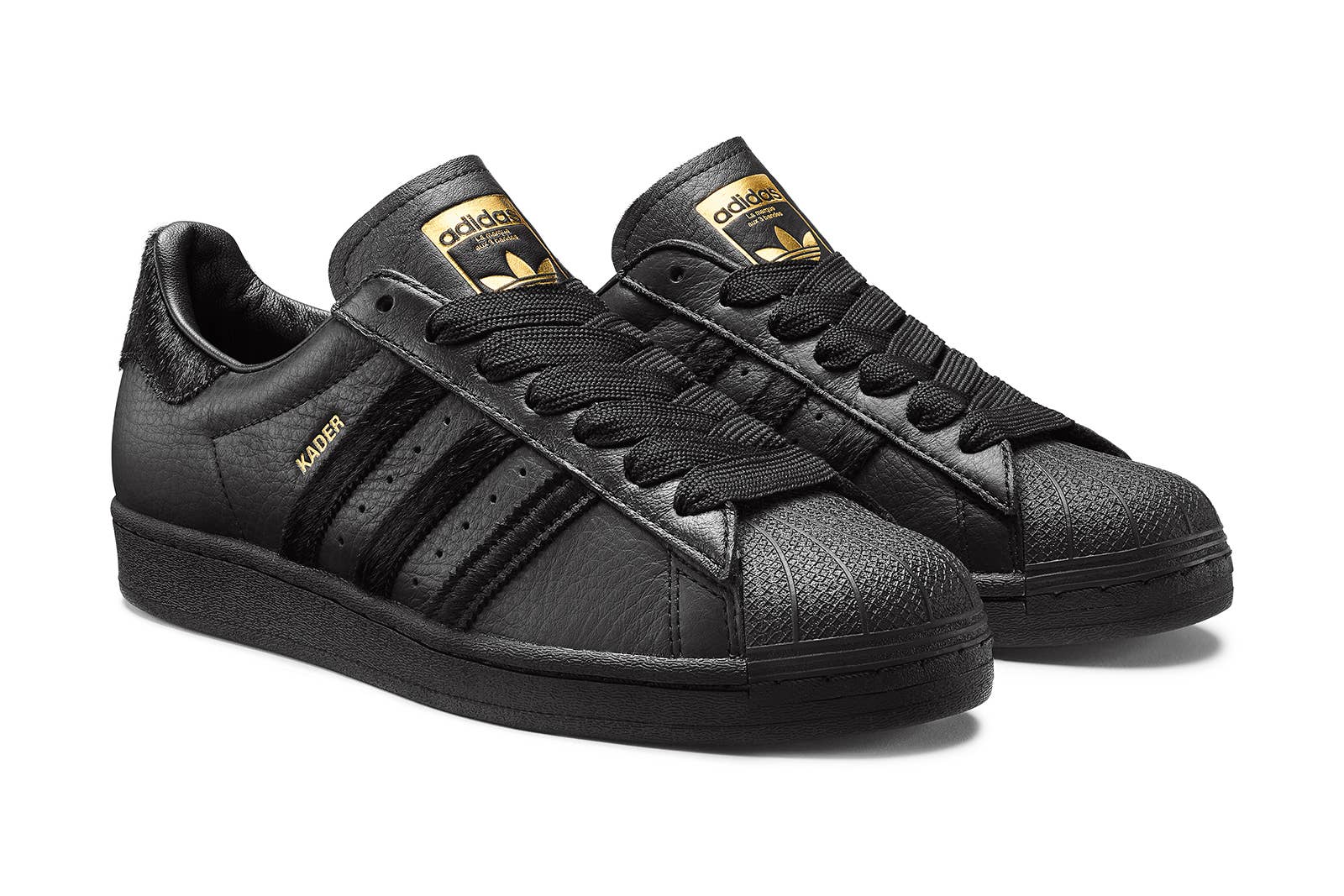 black leather adidas superstars